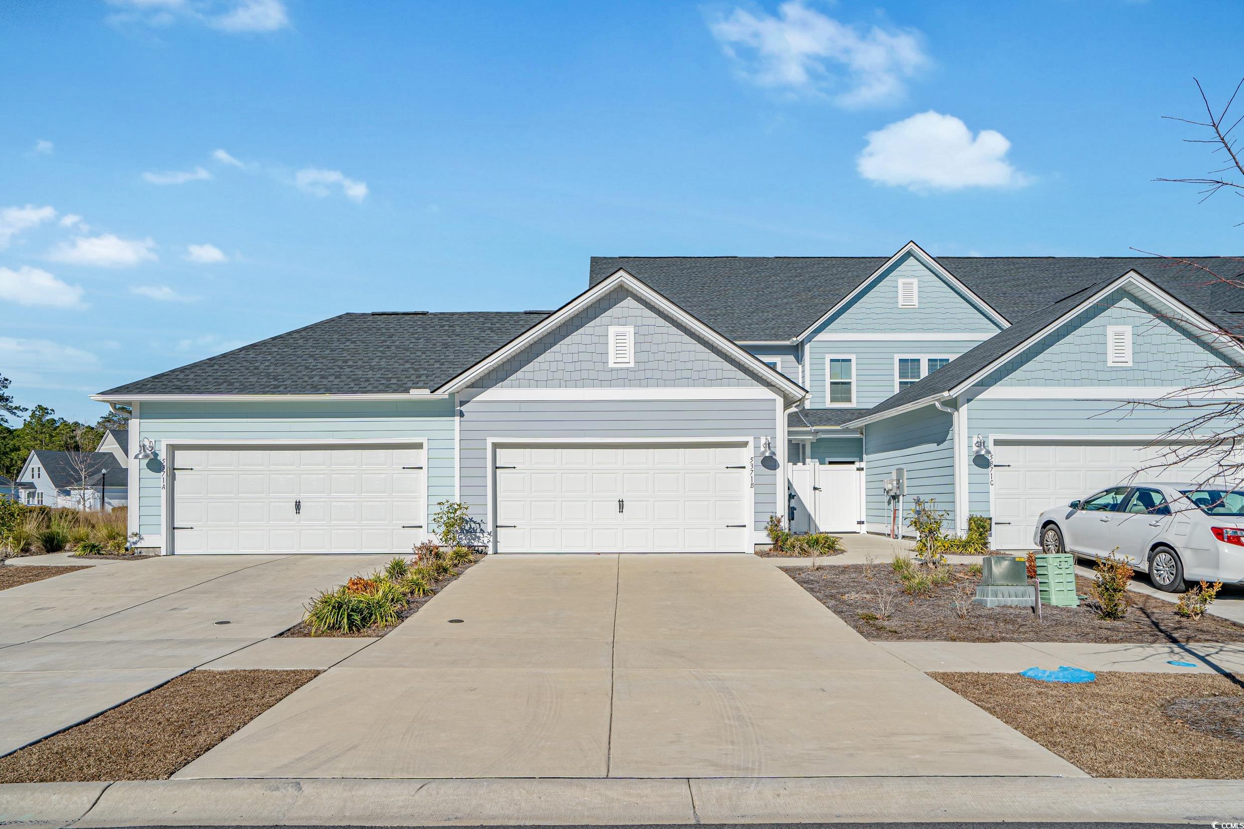 5371 Knobcone Loop, Unit B Myrtle Beach, SC 29577 - Photo 1 of 40 View of front facade featuring a garage