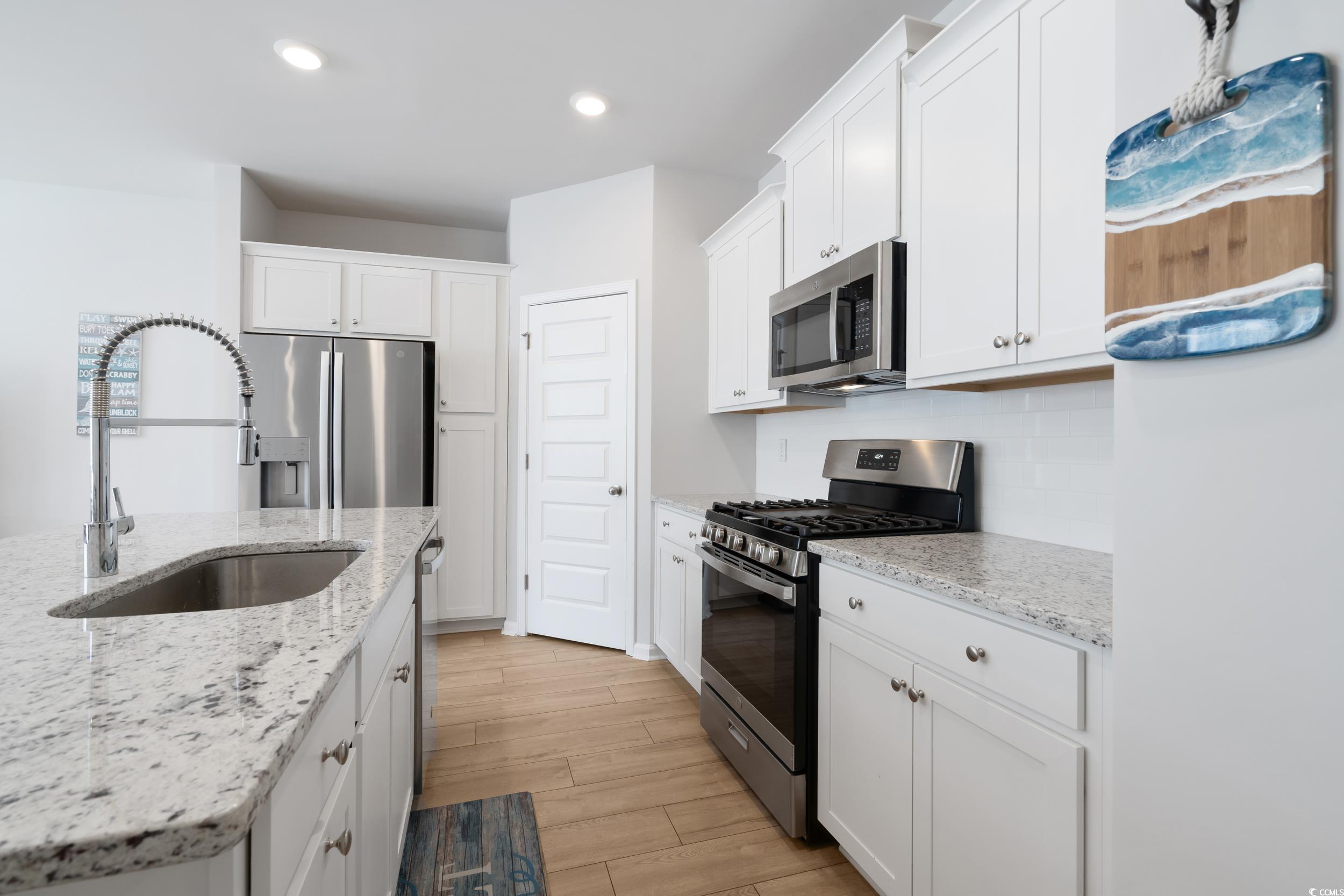 5371 Knobcone Loop, Unit B Myrtle Beach, SC 29577 - Photo 15 of 40 Kitchen featuring stainless steel appliances, sink