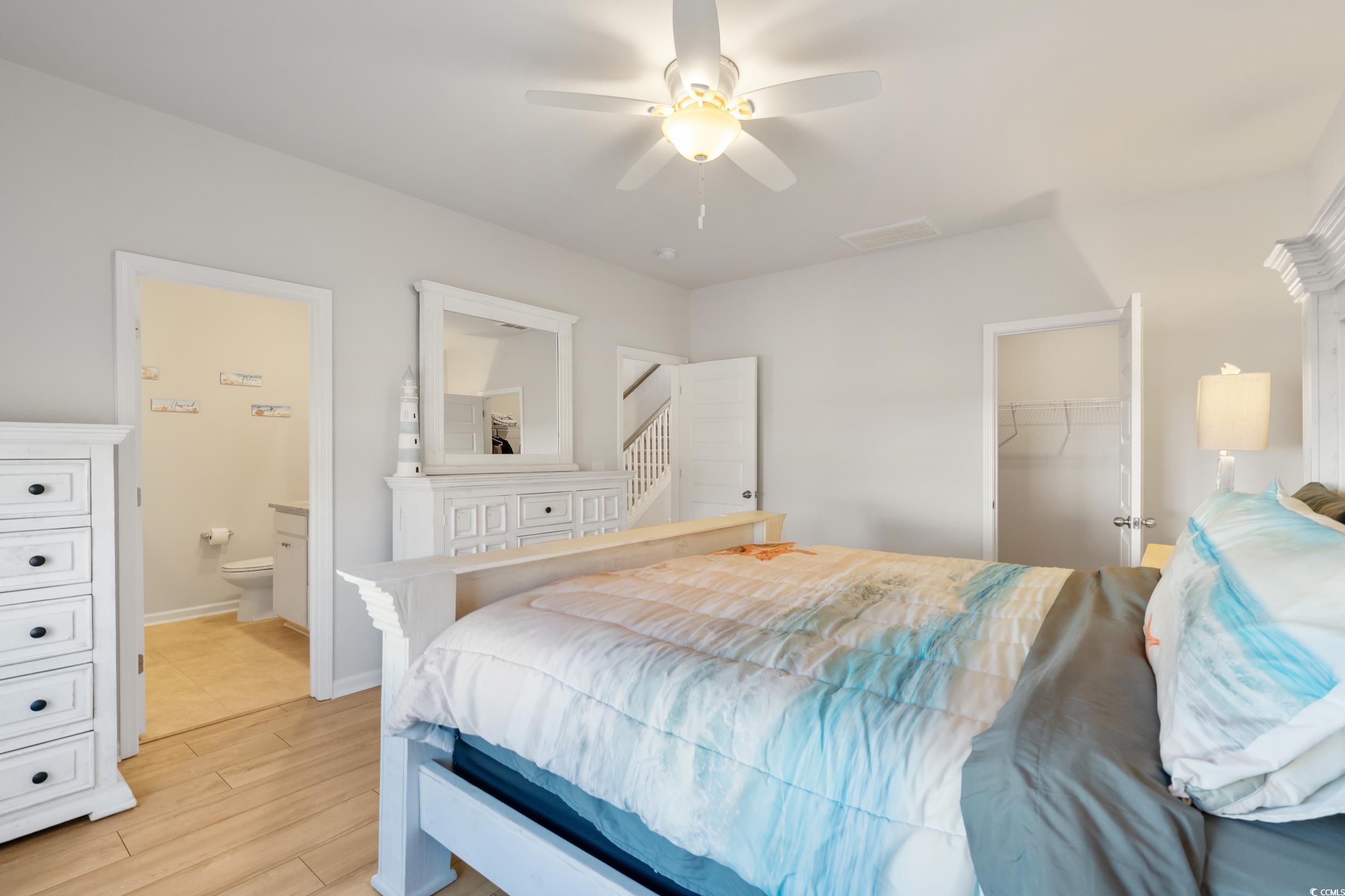 5371 Knobcone Loop, Unit B Myrtle Beach, SC 29577 - Photo 20 of 40 Bedroom with a walk in closet, ceiling fan, a clos