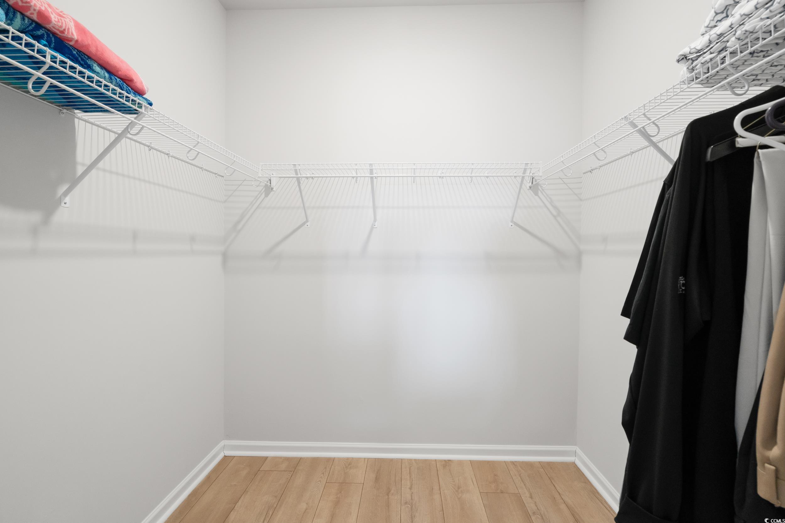 5371 Knobcone Loop, Unit B Myrtle Beach, SC 29577 - Photo 23 of 40 Spacious closet featuring hardwood / wood-style fl