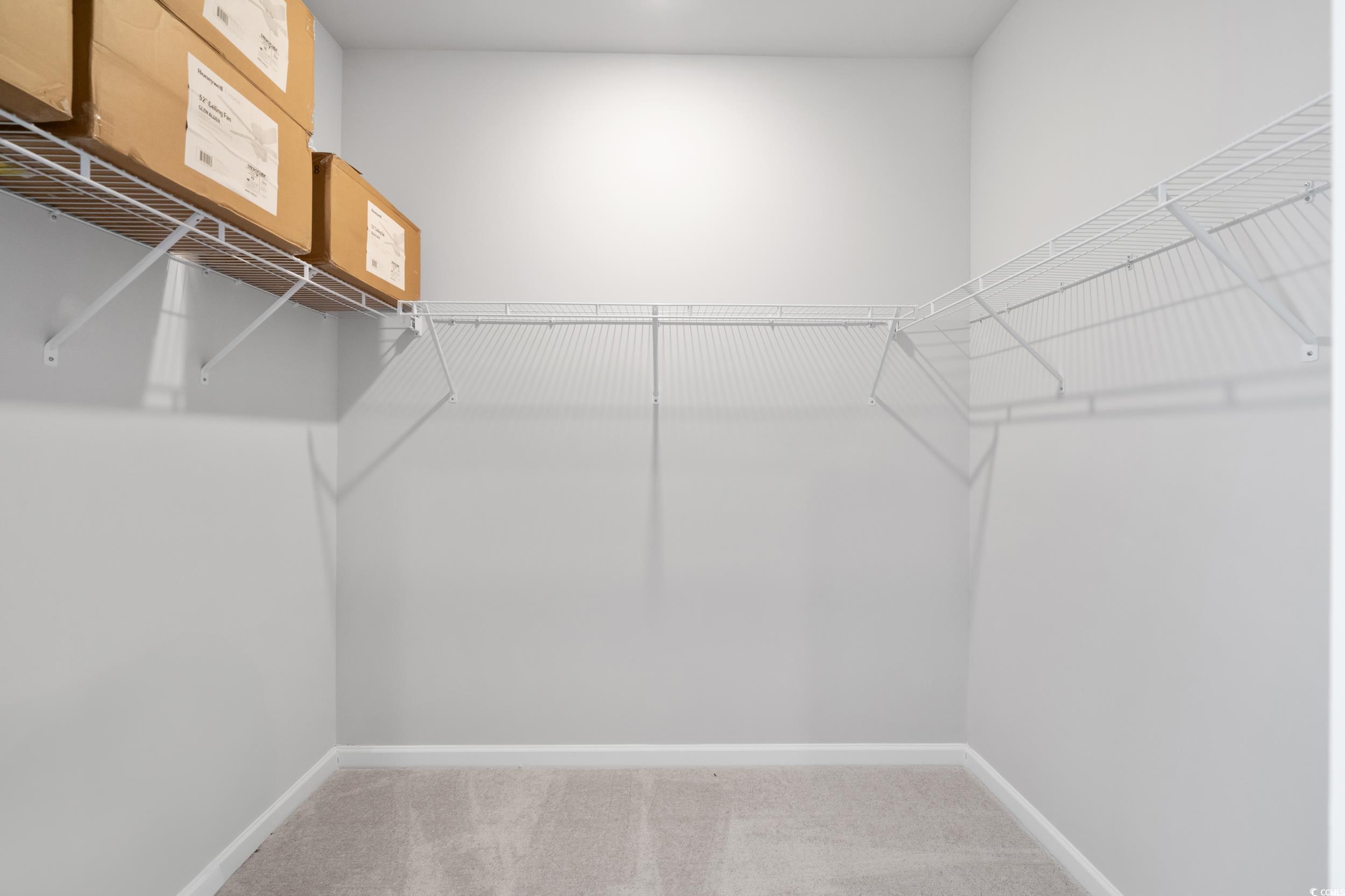 5371 Knobcone Loop, Unit B Myrtle Beach, SC 29577 - Photo 27 of 40 Spacious closet featuring carpet floors