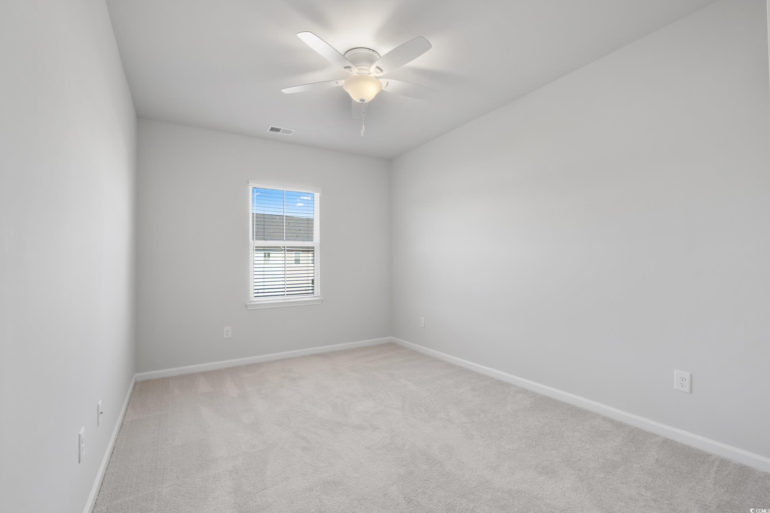 5371 Knobcone Loop, Unit B Myrtle Beach, SC 29577 - Photo 29 of 40 Carpeted spare room with ceiling fan