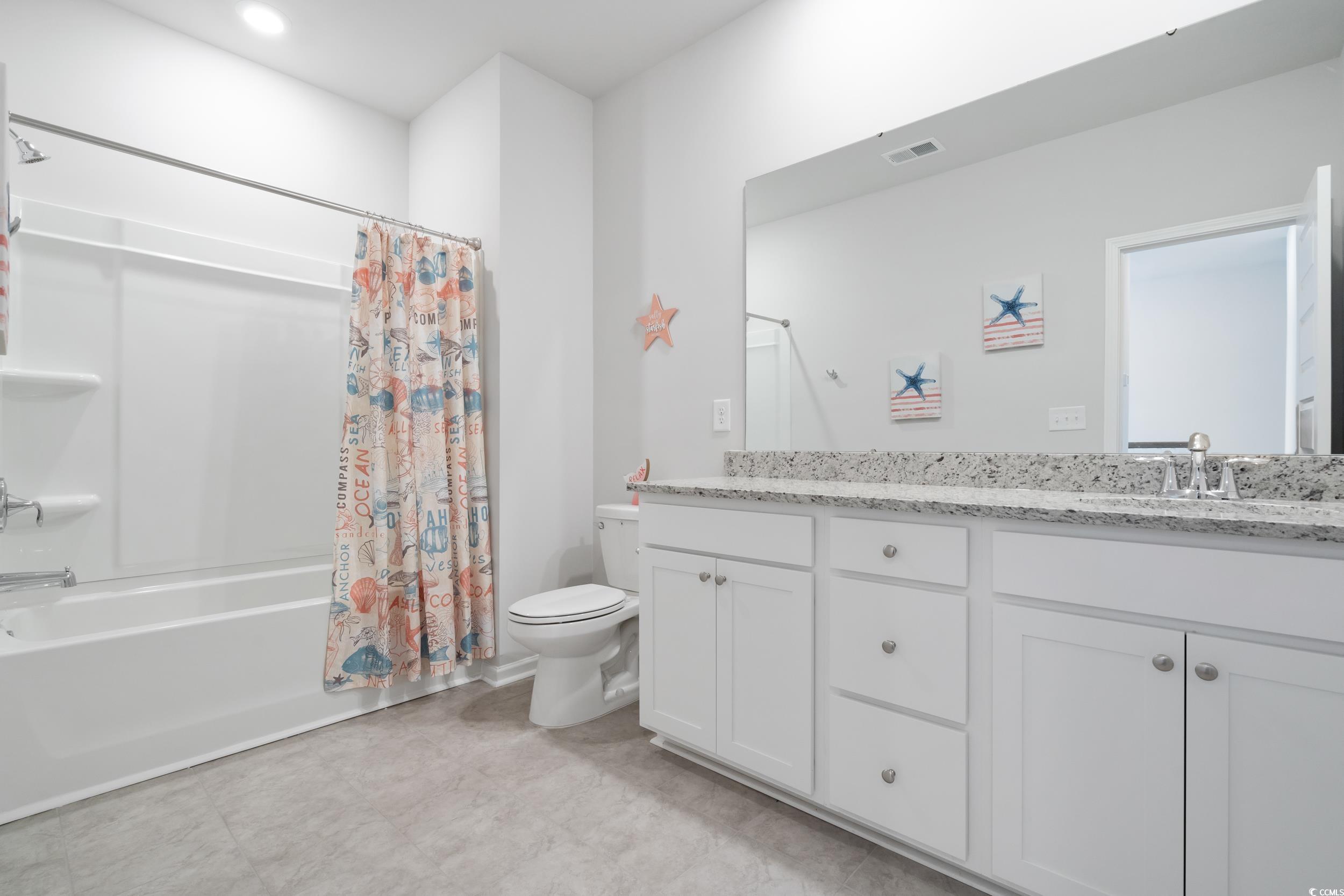 5371 Knobcone Loop, Unit B Myrtle Beach, SC 29577 - Photo 30 of 40 Full bathroom featuring toilet, vanity, and shower