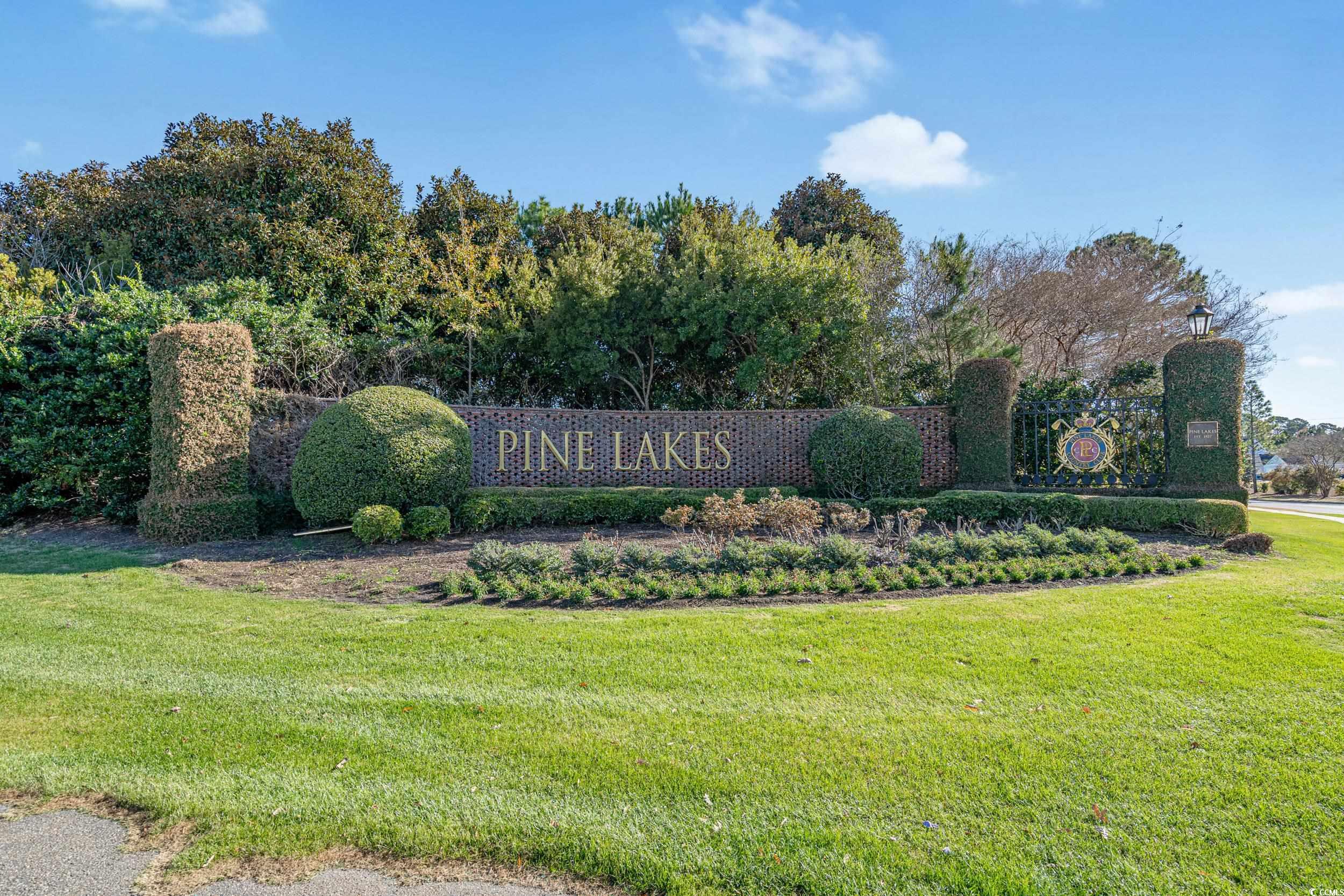 5371 Knobcone Loop, Unit B Myrtle Beach, SC 29577 - Photo 3 of 40 Community sign with a lawn