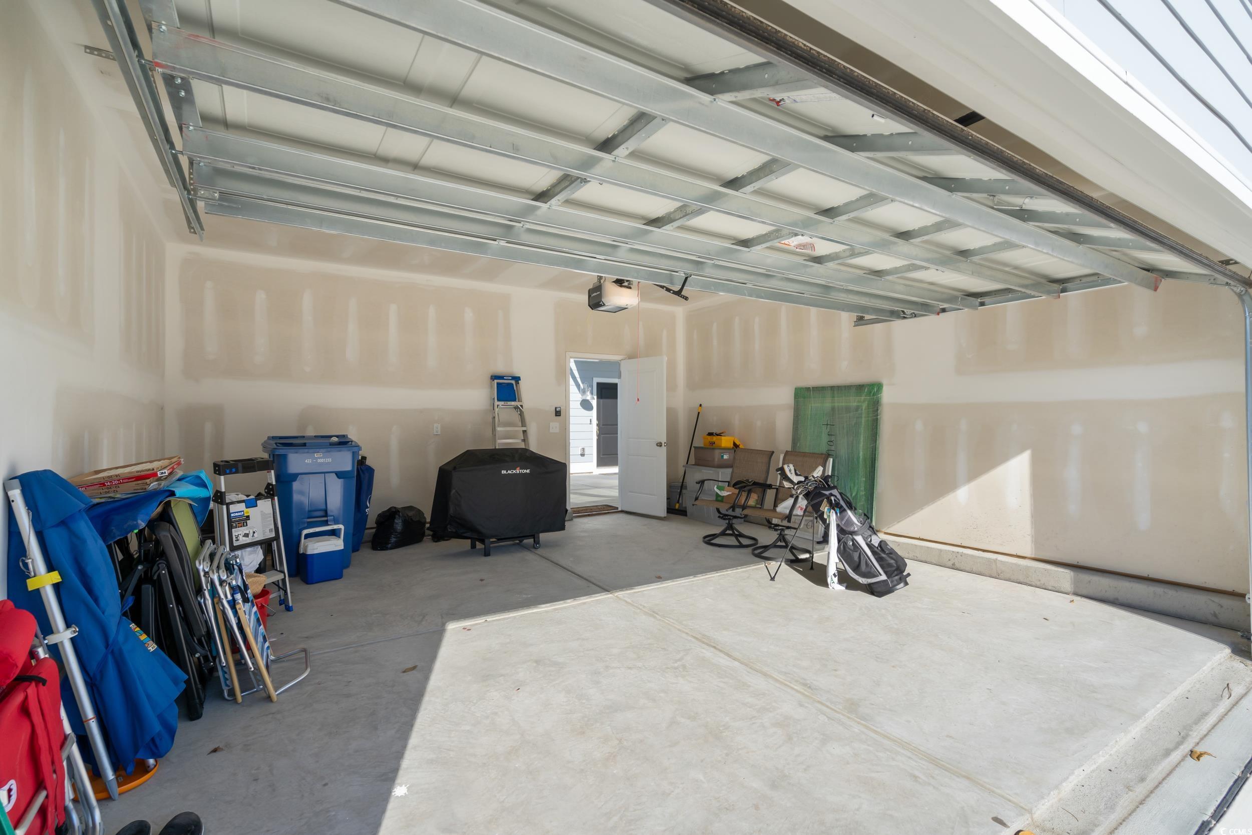 5371 Knobcone Loop, Unit B Myrtle Beach, SC 29577 - Photo 33 of 40 Garage with a garage door opener