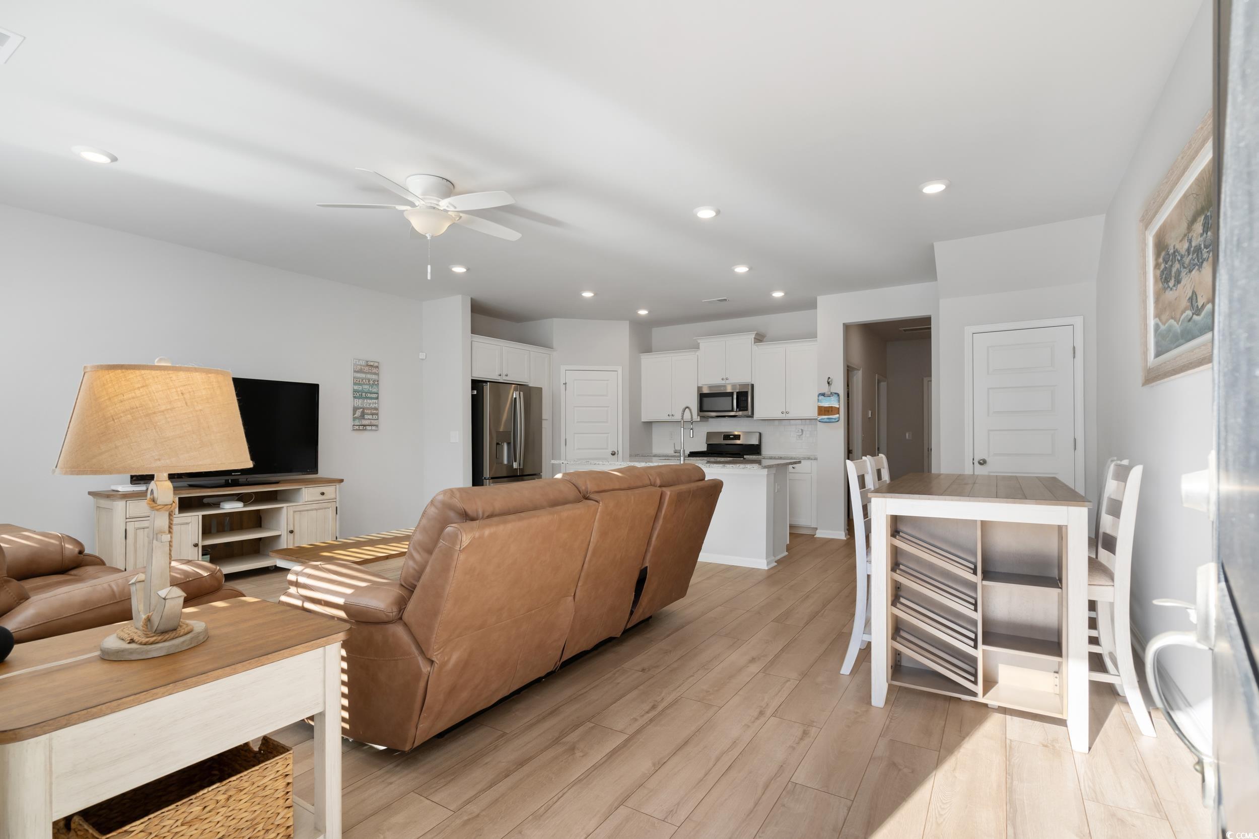 5371 Knobcone Loop, Unit B Myrtle Beach, SC 29577 - Photo 8 of 40 Living room featuring ceiling fan, light hardwood