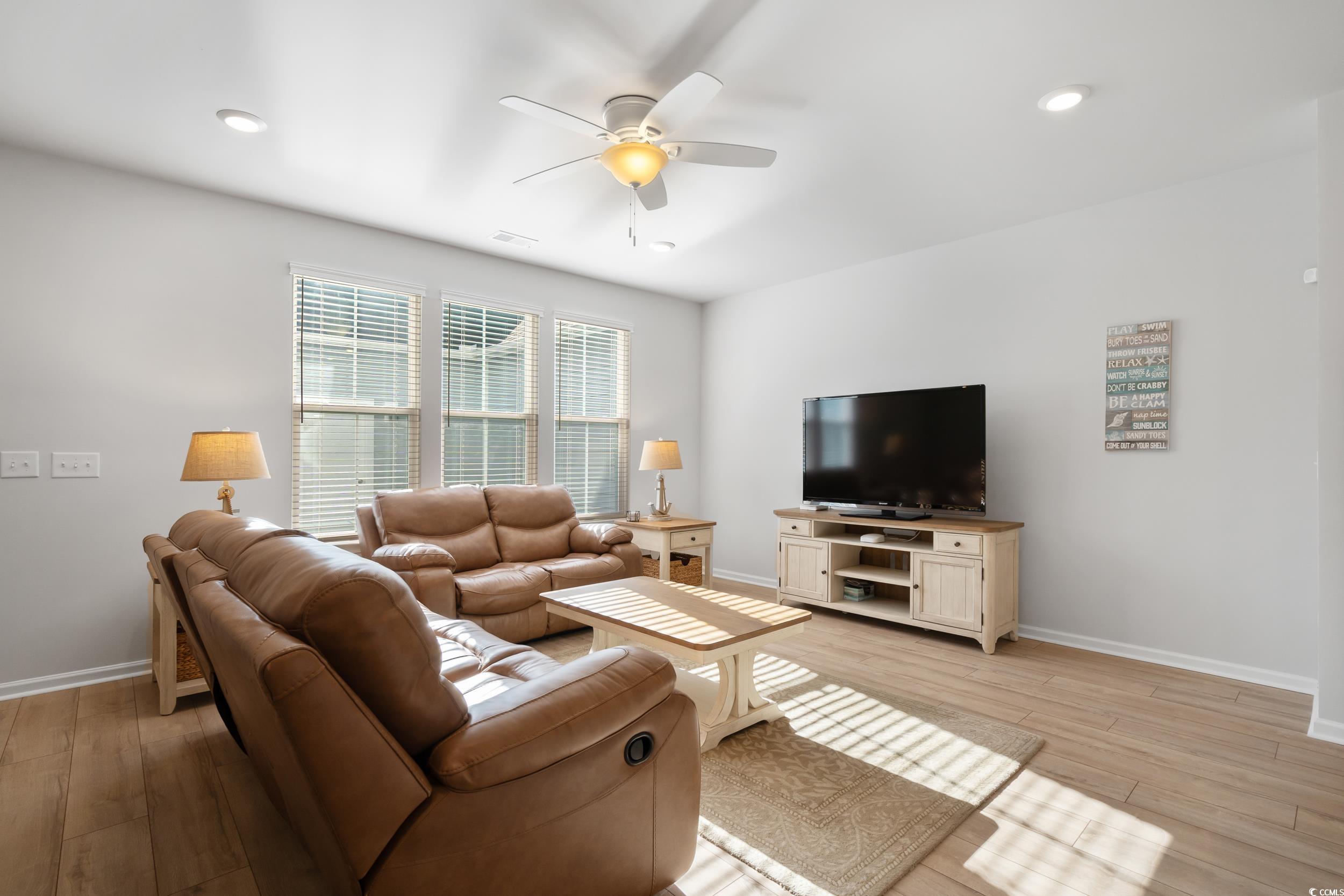 5371 Knobcone Loop, Unit B Myrtle Beach, SC 29577 - Photo 10 of 40 Living room featuring ceiling fan and light hardwo