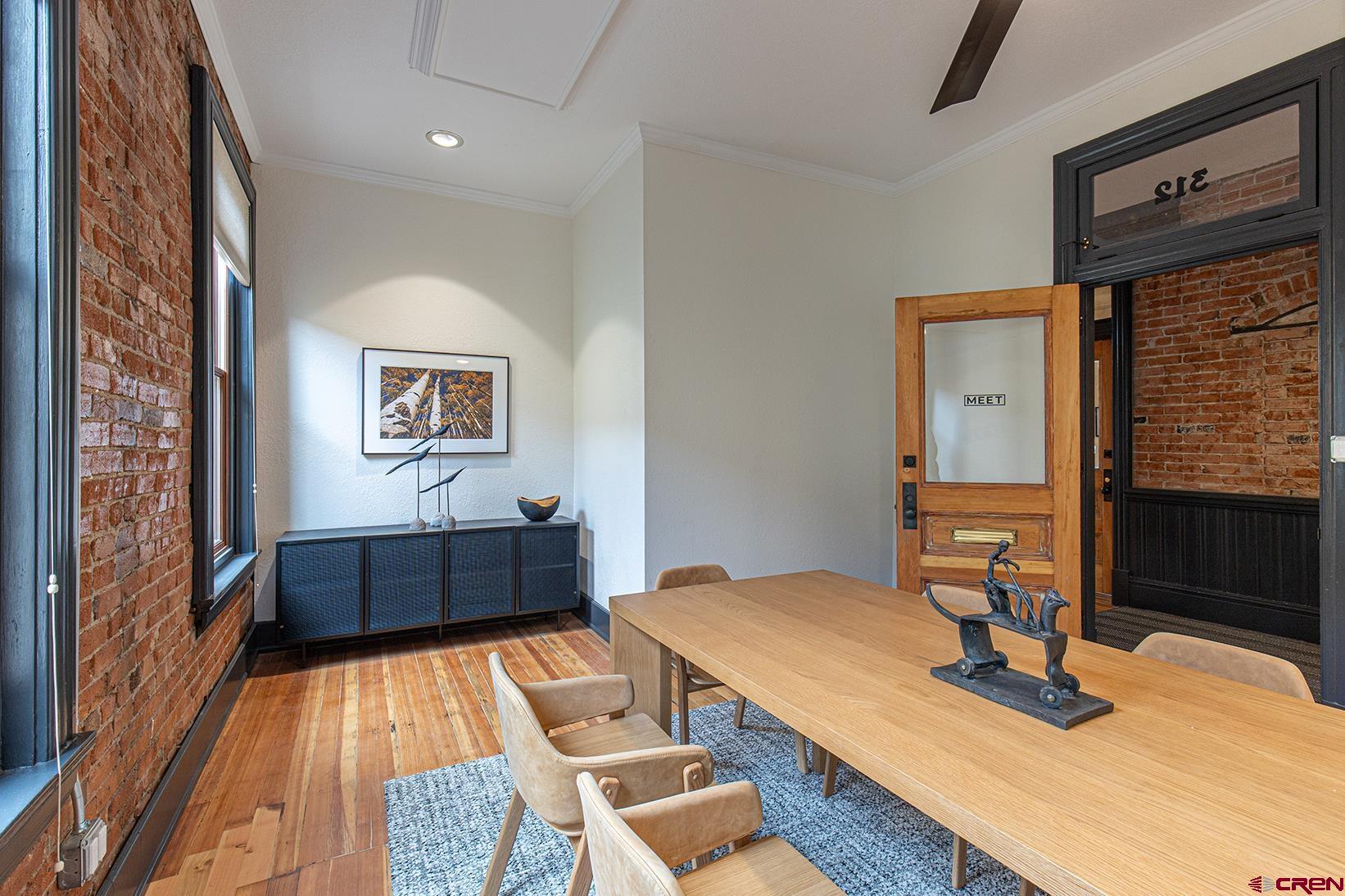 813 Main Avenue, Unit 304 Durango, CO 81301 - Photo 15 of 20 a living room with a couch and a table