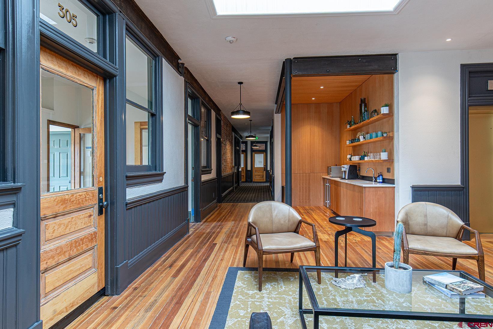 813 Main Avenue, Unit 304 Durango, CO 81301 - Photo 16 of 20 a living room with furniture and a table