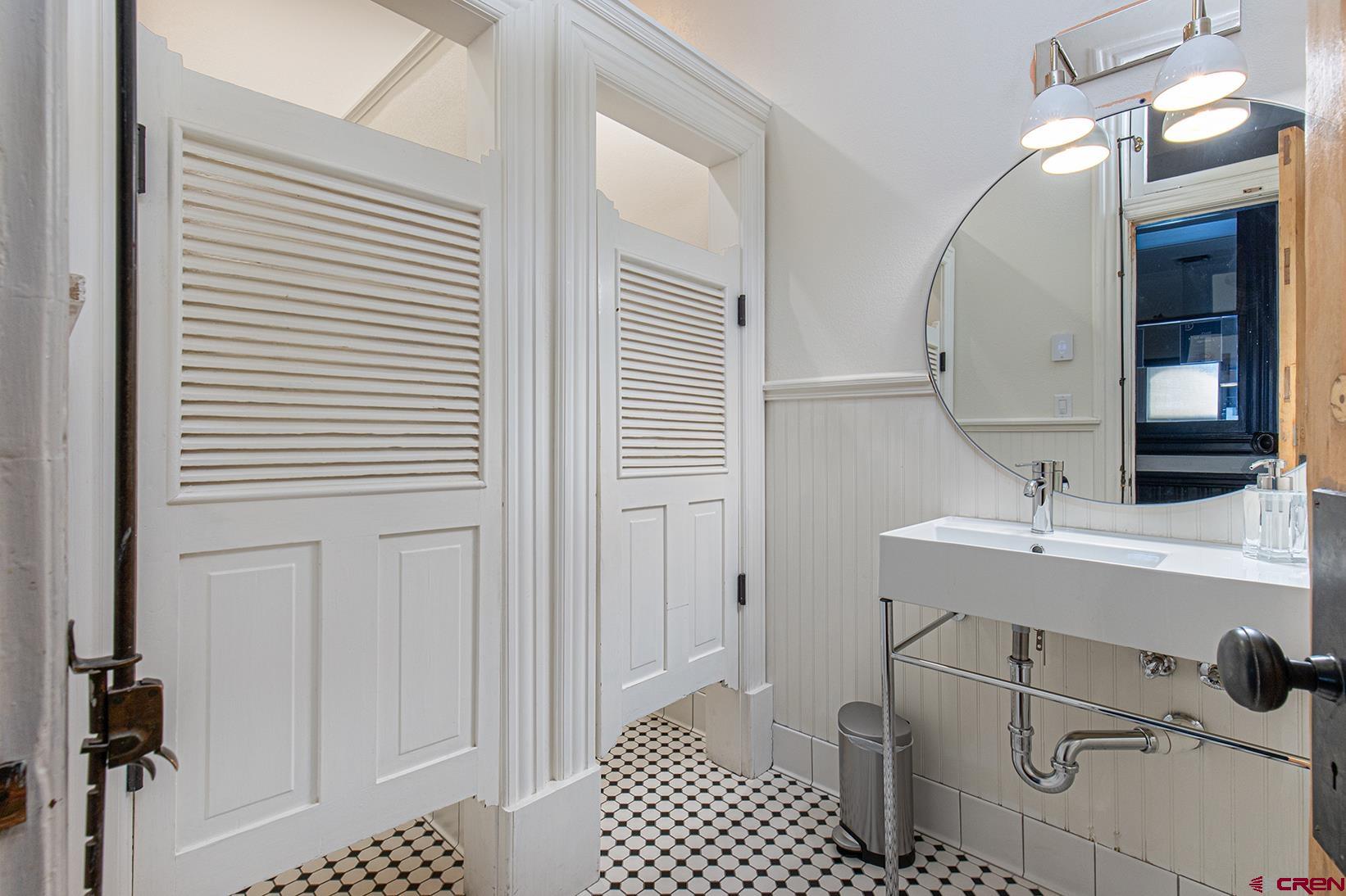 813 Main Avenue, Unit 304 Durango, CO 81301 - Photo 18 of 20 a bathroom with a sink a mirror and a shower