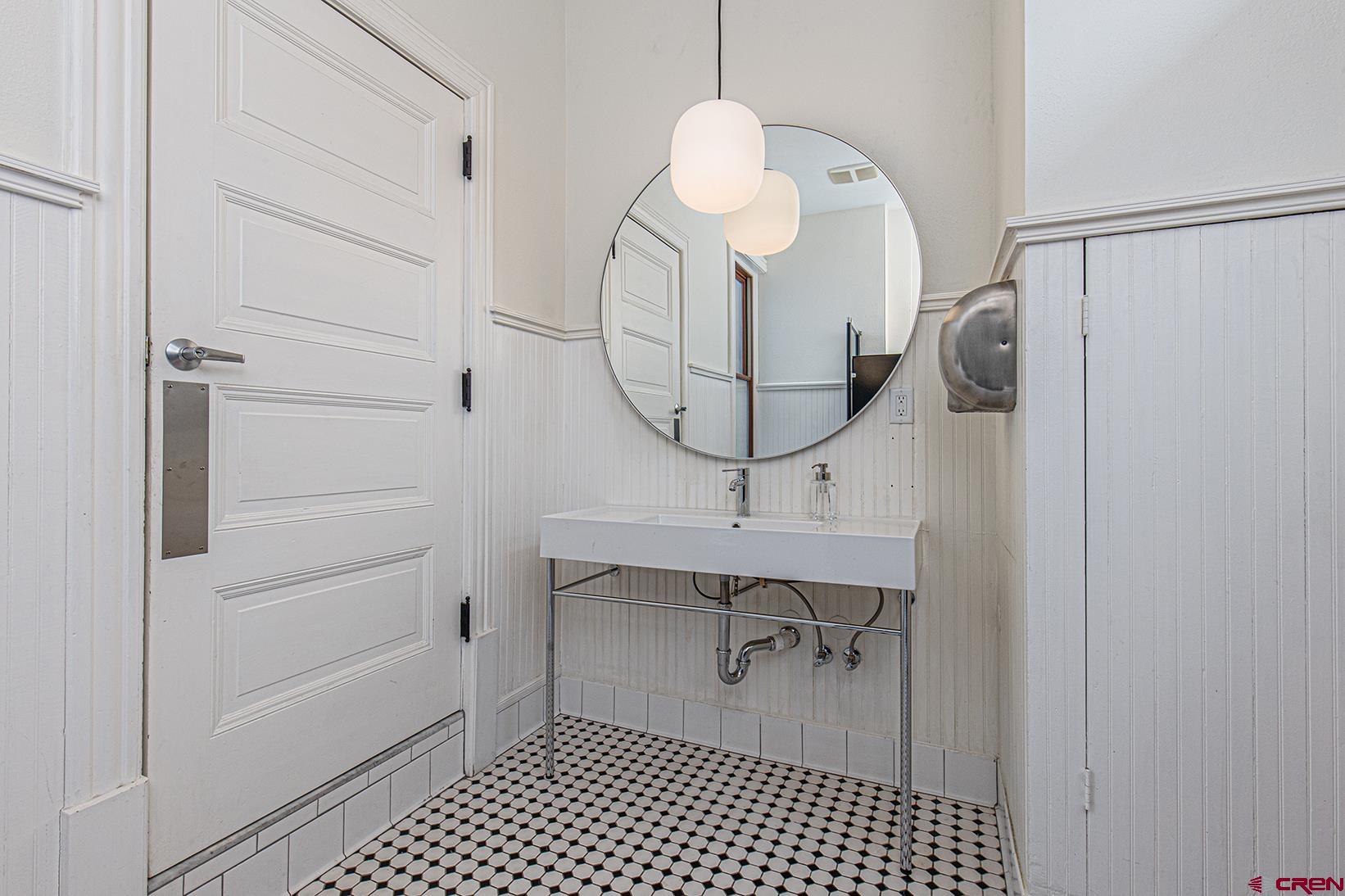 813 Main Avenue, Unit 304 Durango, CO 81301 - Photo 19 of 20 a room with a walk in closet and wooden floor