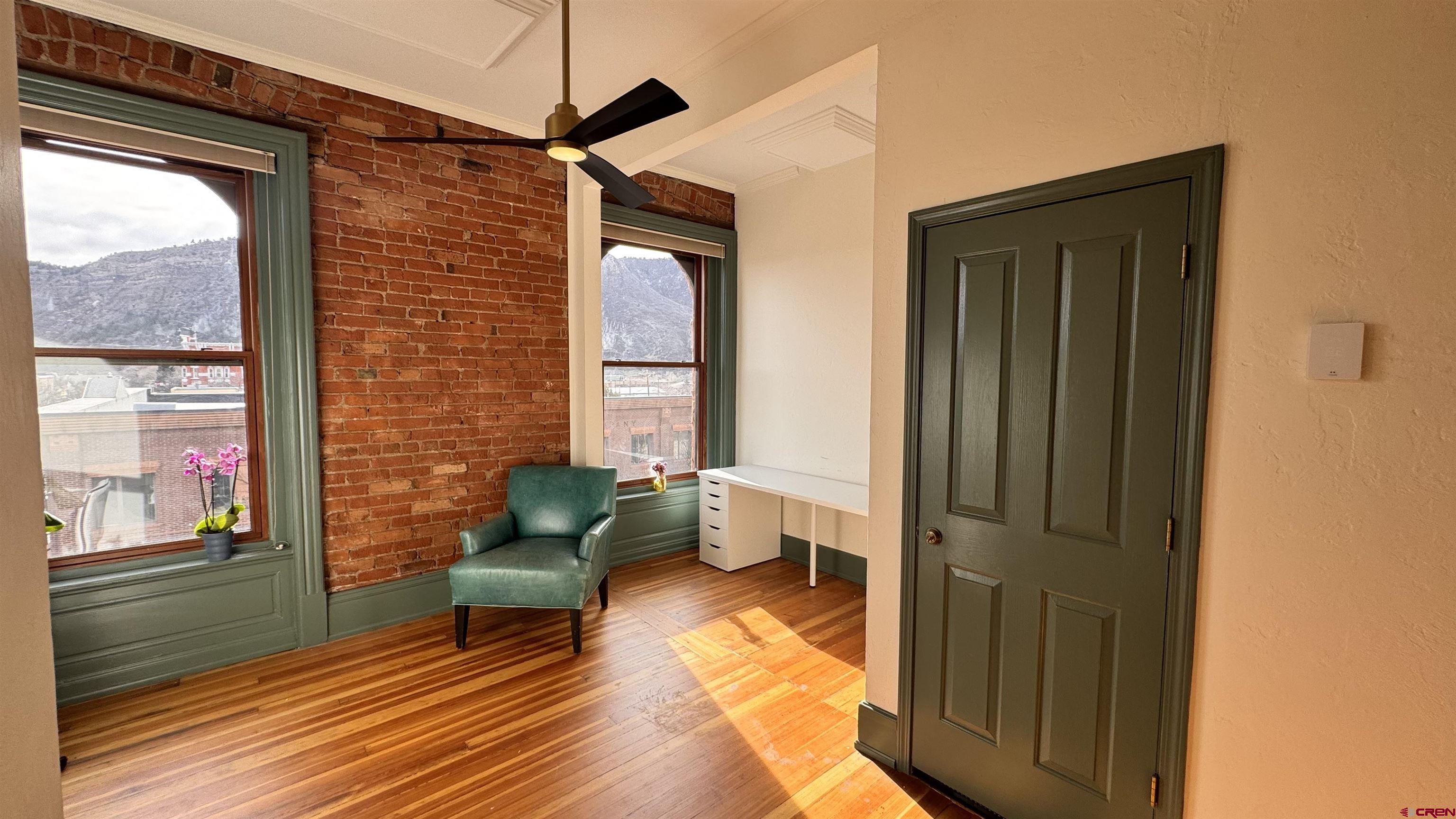 813 Main Avenue, Unit 304 Durango, CO 81301 - Photo 3 of 20 a living room with furniture and a gate