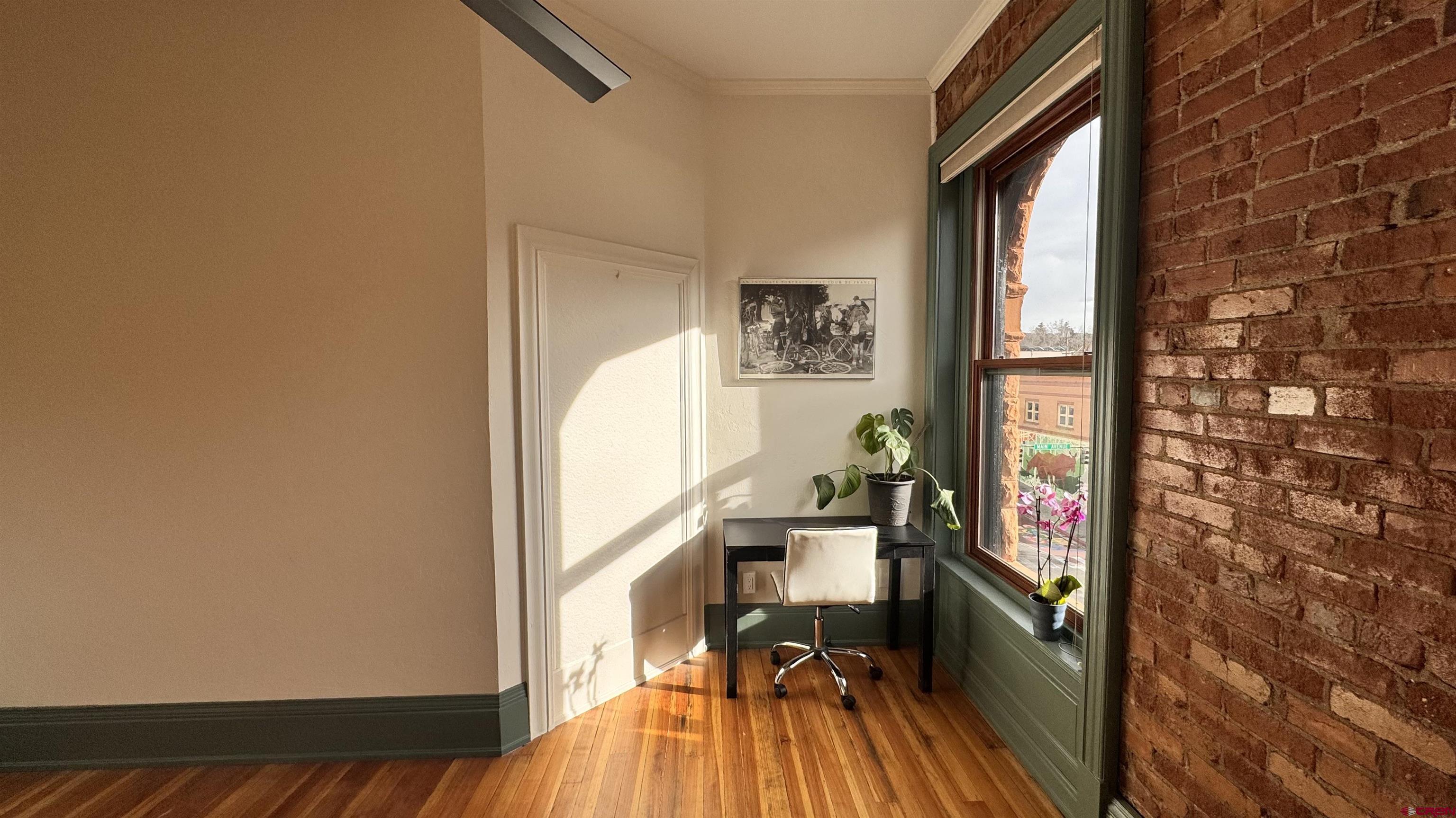 813 Main Avenue, Unit 304 Durango, CO 81301 - Photo 4 of 20 a view of a workspace with furniture and a window
