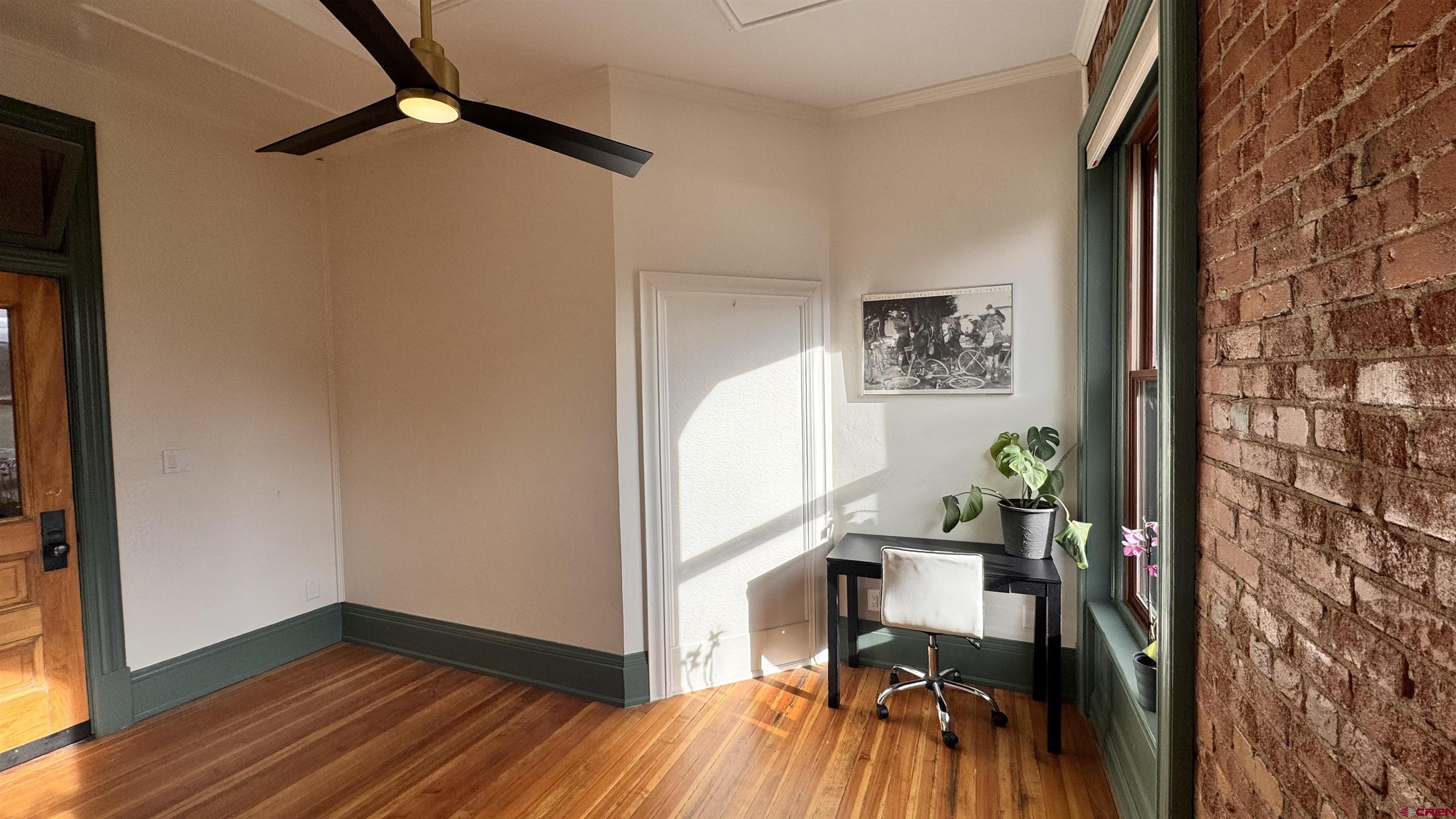 813 Main Avenue, Unit 304 Durango, CO 81301 - Photo 5 of 20 a view of a workspace with wooden floor and a hallway