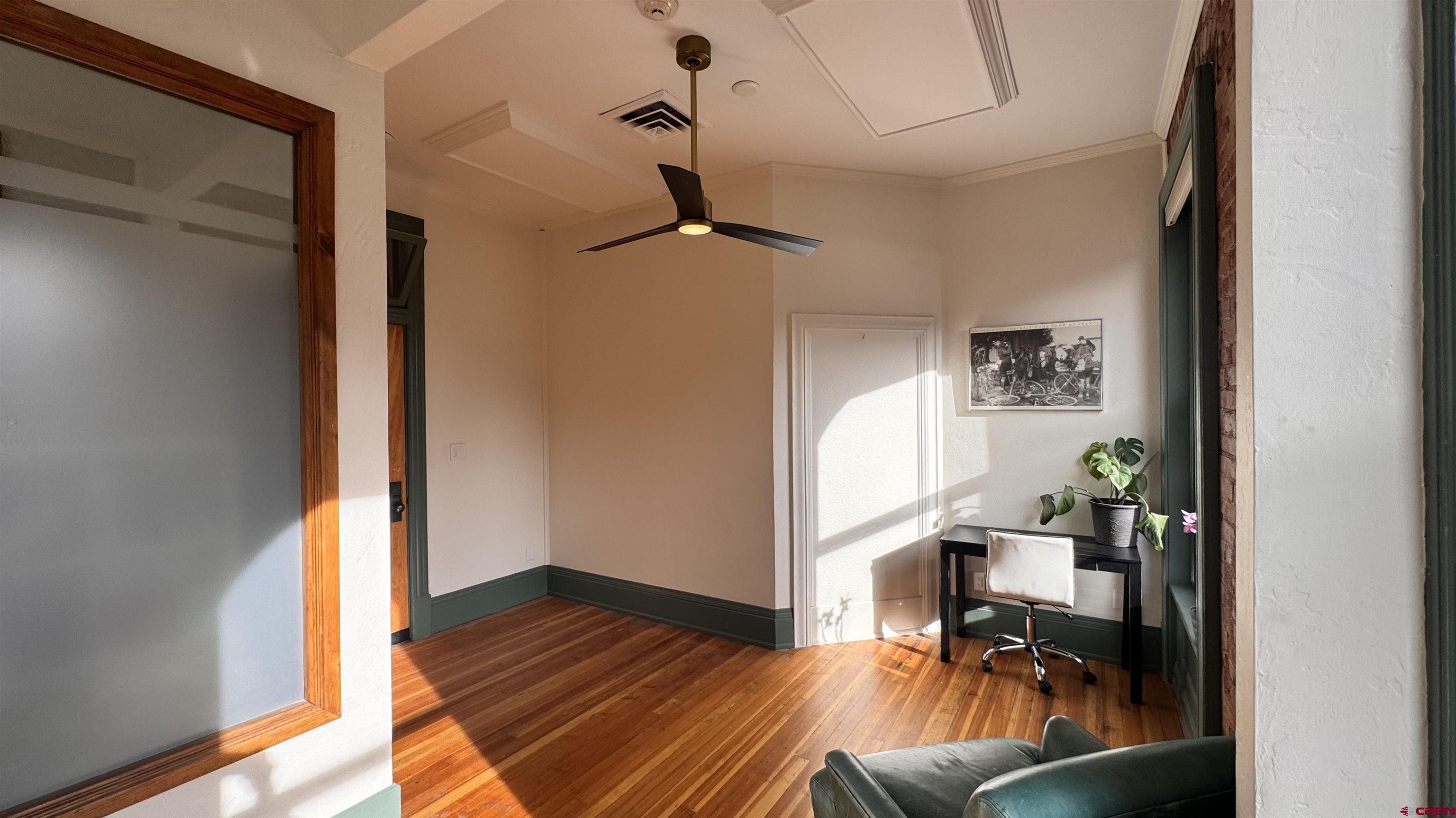 813 Main Avenue, Unit 304 Durango, CO 81301 - Photo 6 of 20 a view of a workspace with furniture and wooden floor