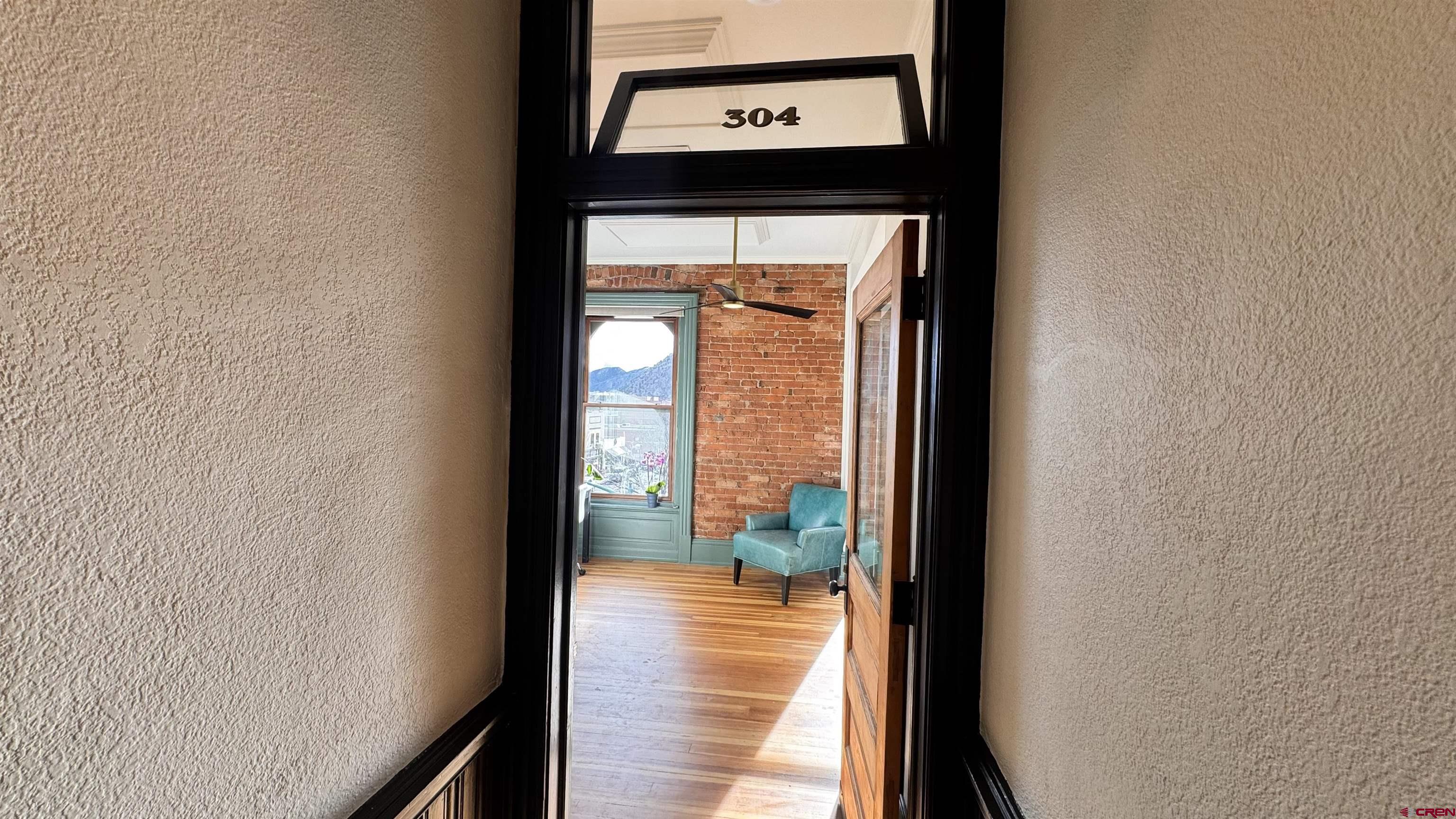 813 Main Avenue, Unit 304 Durango, CO 81301 - Photo 10 of 20 a view of a hallway with wooden floor