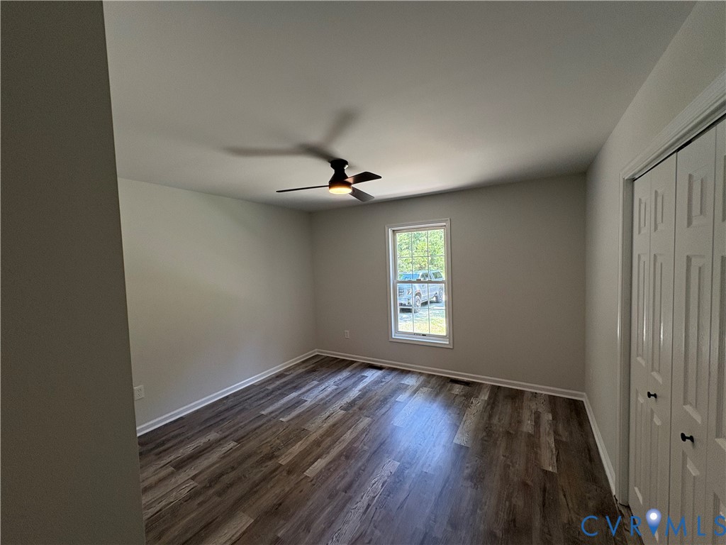 14002 Sunnybrook Road Petersburg, VA 23805 - Photo 11 of 21 Room featuring wood-finish flooring, neutral wall