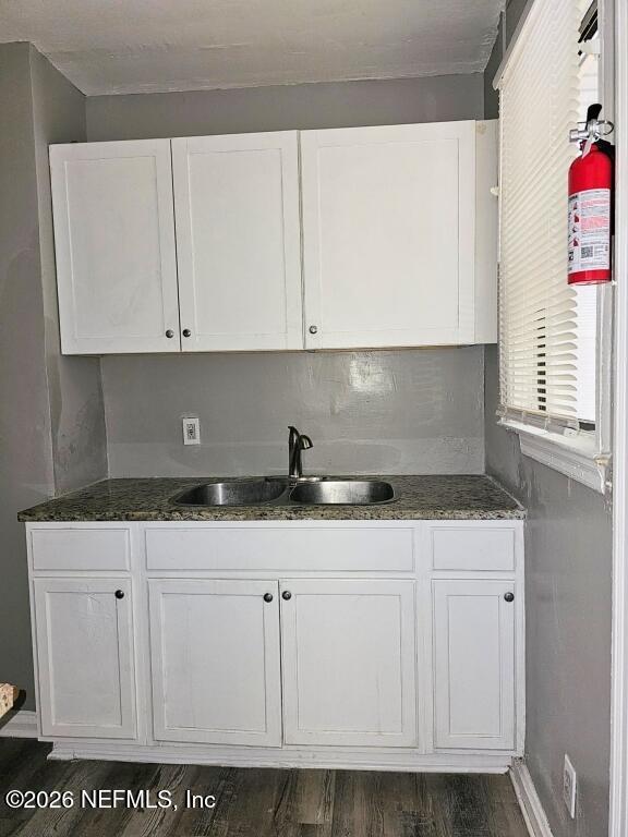 3219 Thomas Street Jacksonville, FL 32254 - Photo 5 of 6 a kitchen with granite countertop white cabinets and a sink