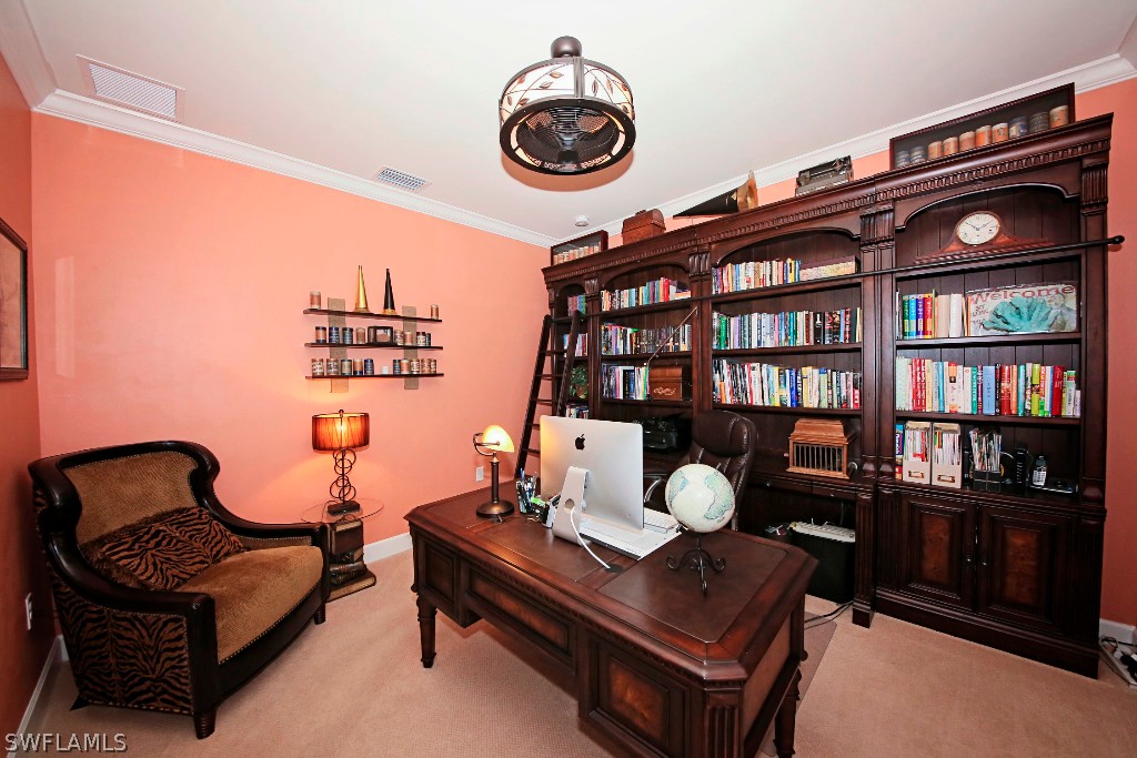 10871 Rutherford Road Fort Myers, FL 33913 - Photo 3 of 25 a living room with furniture and book shelf