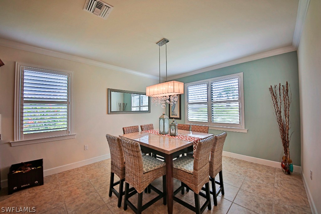 10871 Rutherford Road Fort Myers, FL 33913 - Photo 7 of 25 a dining room with furniture and window
