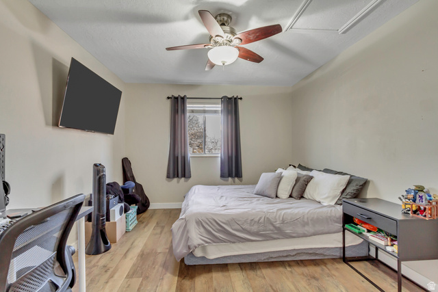 933 South Freedom Boulevard, Unit 7 Provo, UT 84601 - Photo 12 of 23 Bedroom featuring light wood-type flooring and ceiling fan