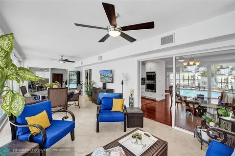 a view of a livingroom with furniture and a window