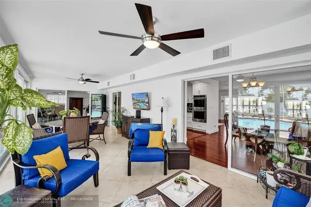 a view of a livingroom with furniture and a window