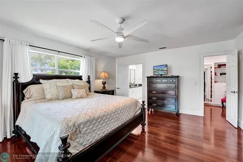 a large kitchen with a sink and cabinets