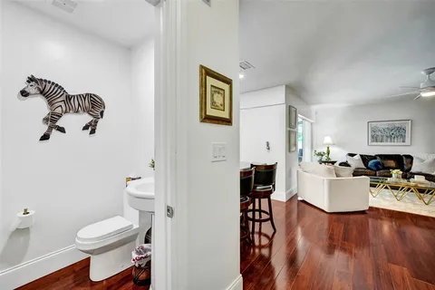 a living room with a couch and wooden floor
