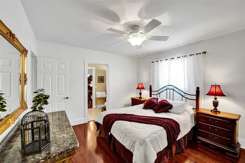 a bedroom with furniture and a chandelier