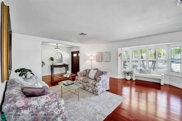 a couple of palm trees in front of house