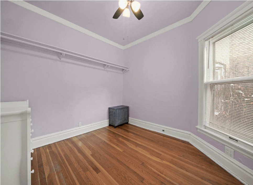 1067 West Balmoral Avenue, Unit 2 Chicago, IL 60640 - Photo 12 of 15 a room with a window and a ceiling fan