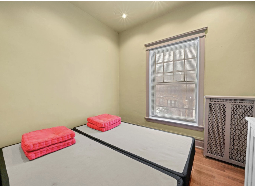 1067 West Balmoral Avenue, Unit 2 Chicago, IL 60640 - Photo 13 of 15 a bedroom with a bed and a window
