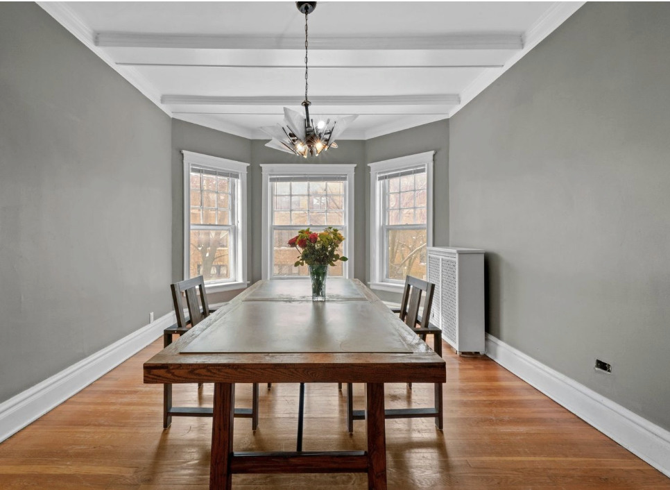 1067 West Balmoral Avenue, Unit 2 Chicago, IL 60640 - Photo 6 of 15 a view of a dining room with furniture window and wooden floor