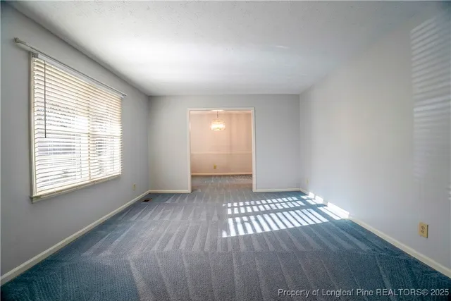 a view of an empty room and window