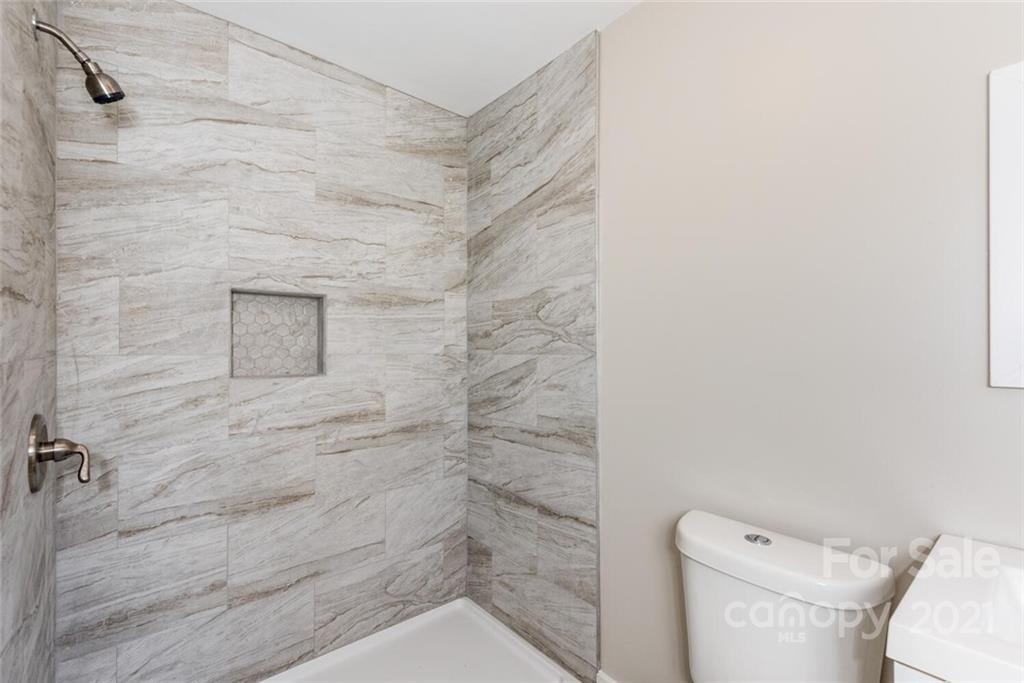 87-j R J R Sayles Road Canton, NC 28716 - Photo 10 of 22 a bathroom with a toilet and a shower