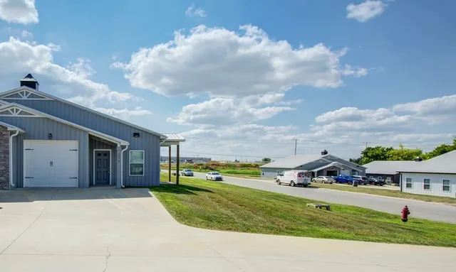 a view of an house with backyard and entertaining space