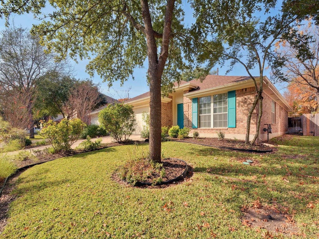 13300 Rochester Lane Austin, TX 78753 - Photo 1 of 1 a front view of a house with yard and green space