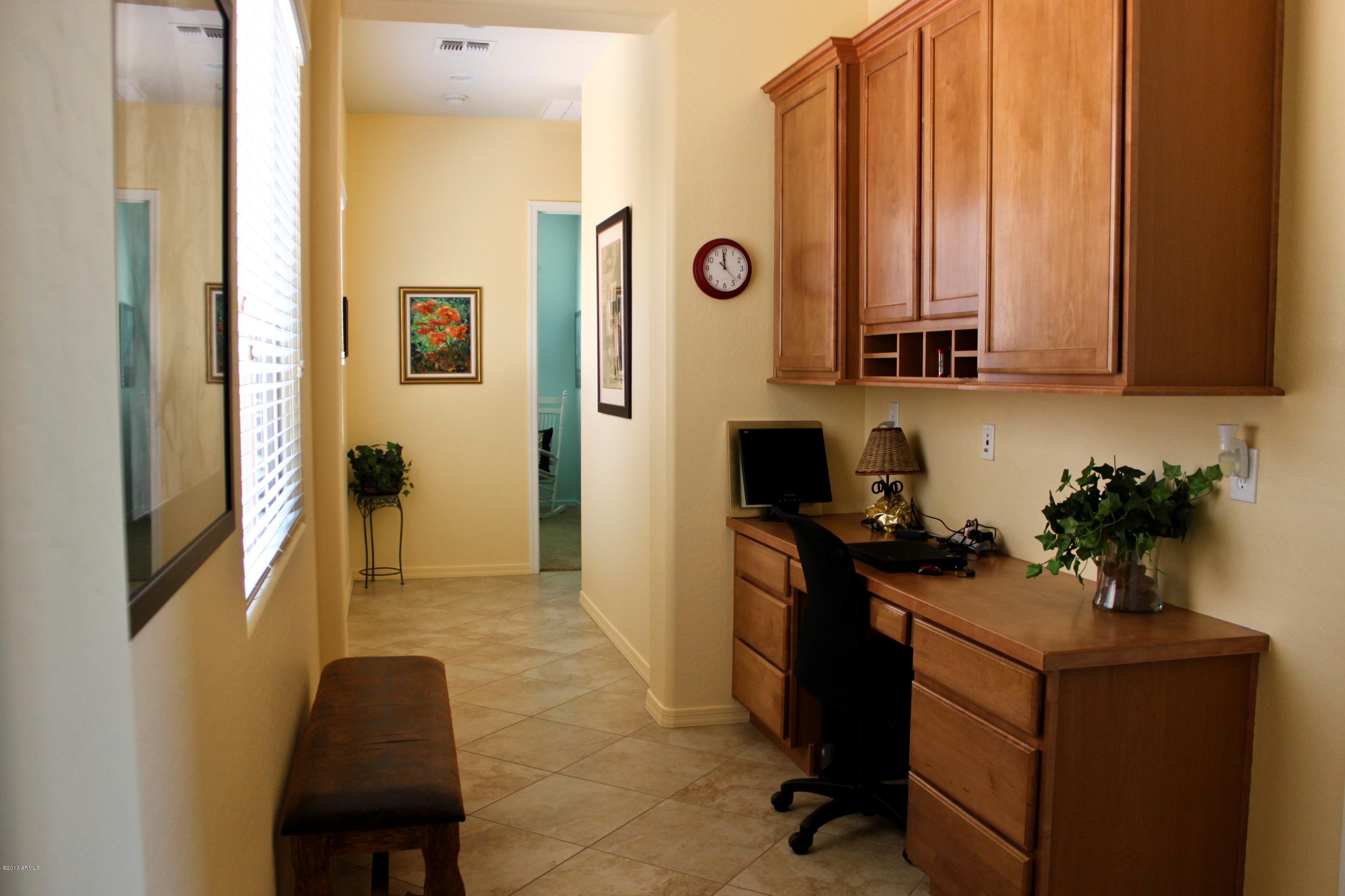 1928 West Peak View Road Phoenix, AZ 85085 - Photo 18 of 35 a kitchen with a sink and a refrigerator