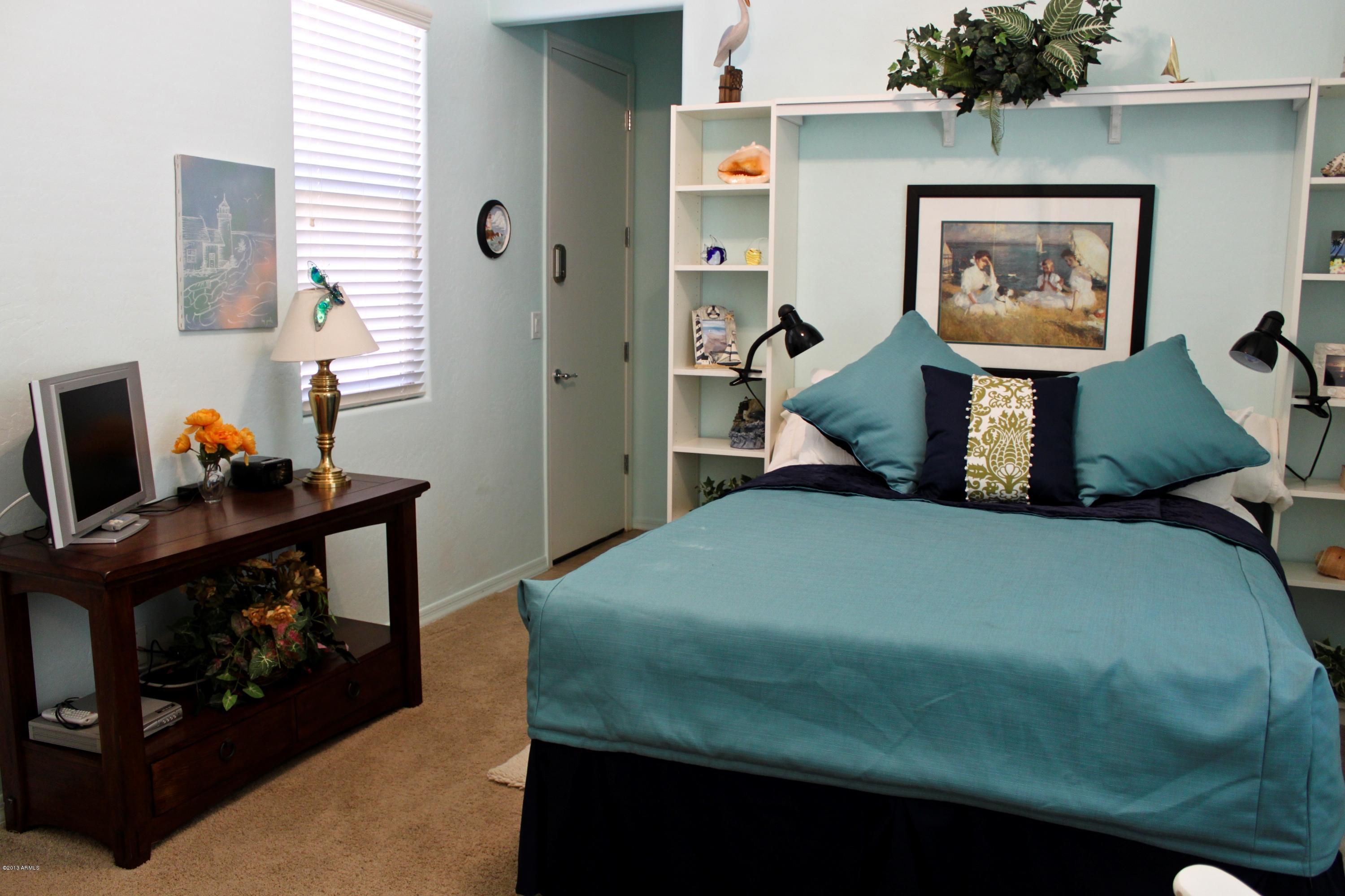 1928 West Peak View Road Phoenix, AZ 85085 - Photo 23 of 35 a bedroom with a bed and a window