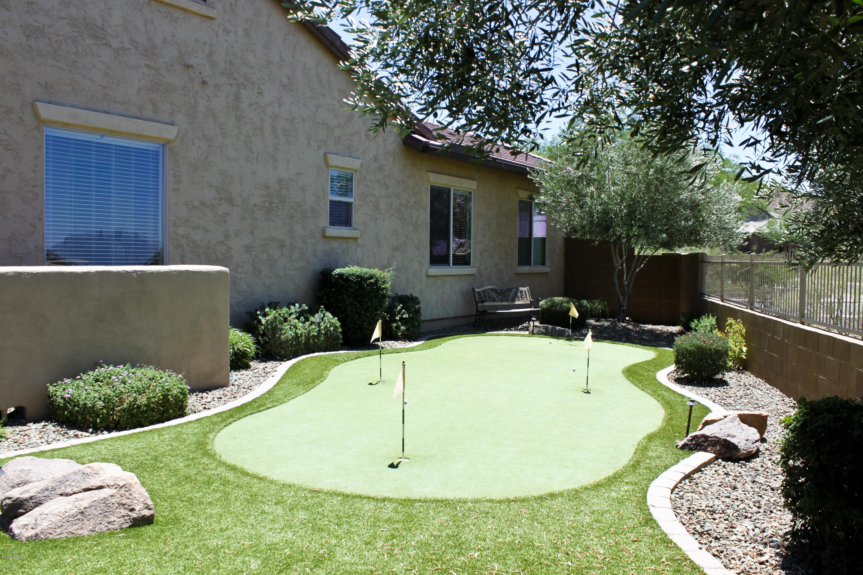 1928 West Peak View Road Phoenix, AZ 85085 - Photo 3 of 35 a swimming pool with some potted plants and large tree