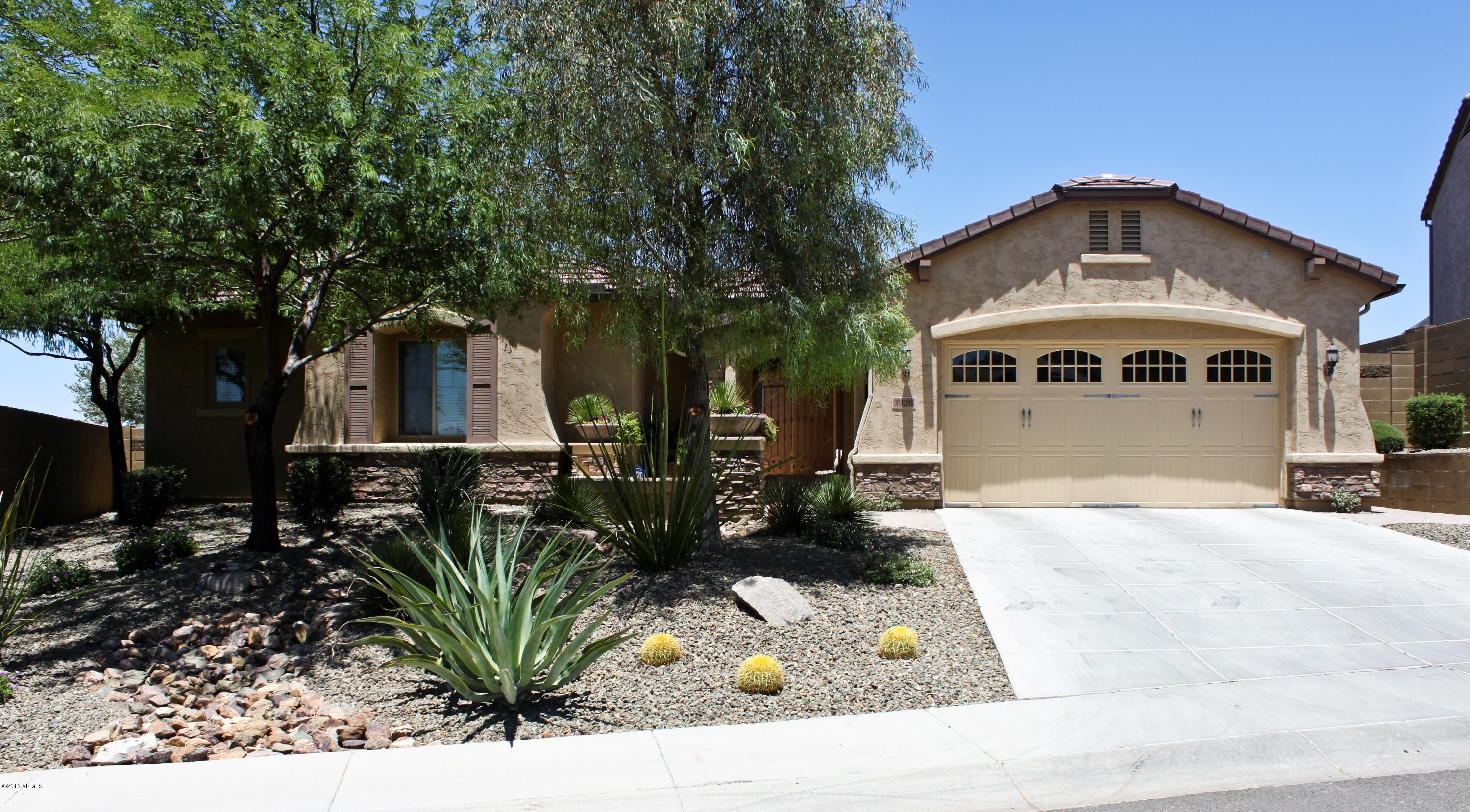 1928 West Peak View Road Phoenix, AZ 85085 - Photo 35 of 35 a front view of a house with a yard