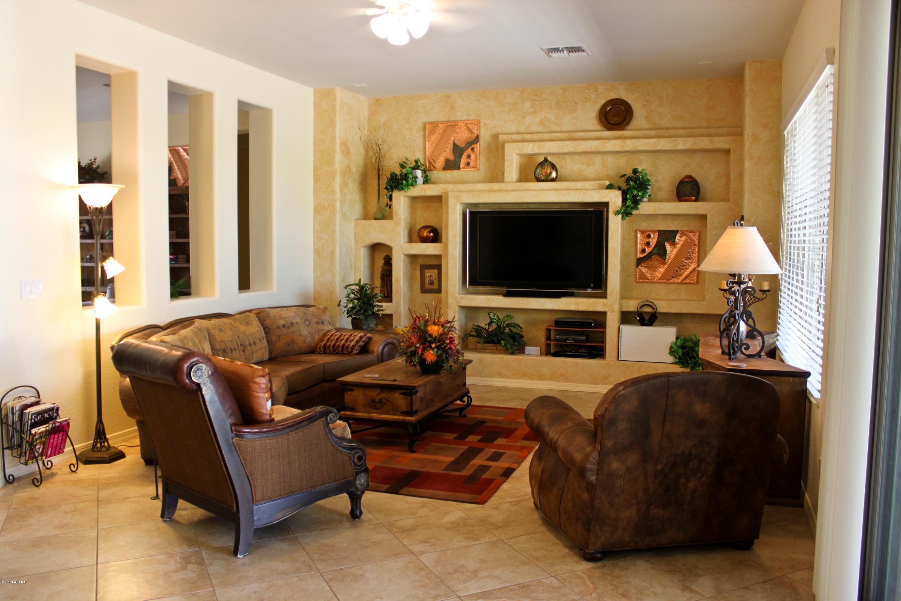 1928 West Peak View Road Phoenix, AZ 85085 - Photo 8 of 35 a living room with furniture and a flat screen tv