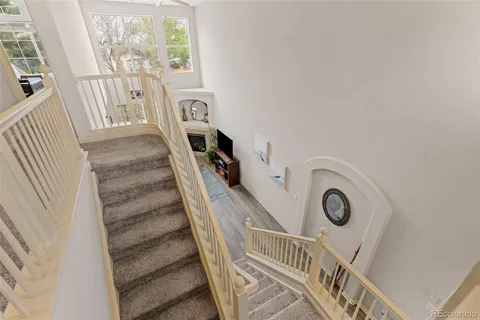a view of entryway with a window and hardwood floor