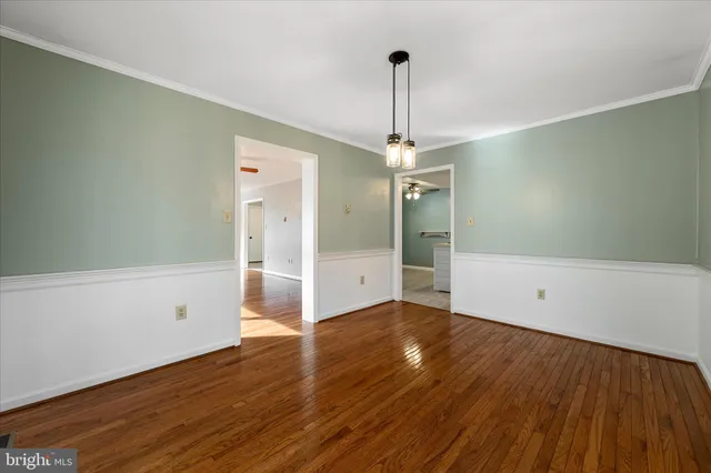 a kitchen with a refrigerator sink and cabinets