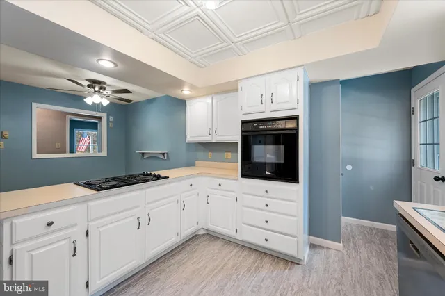 a kitchen with a table and chairs in it