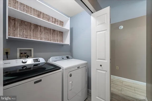 a view of a balcony with wooden fence