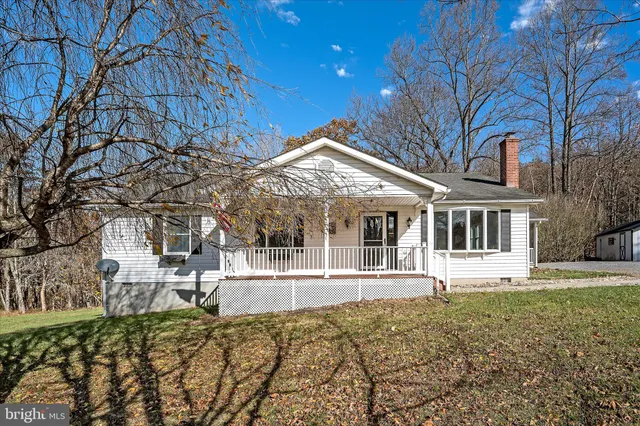 a view of a chairs and table in patio