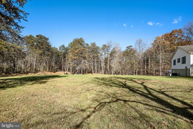 a view of outdoor space with playground and green space
