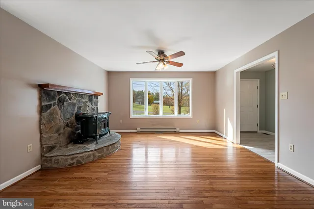 a view of fireplace with wooden floor